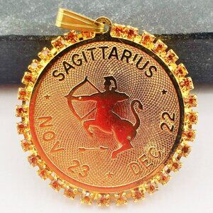 VINTAGE Sagittarius gold tone metal citrine coloured rhinestone circle pendant
